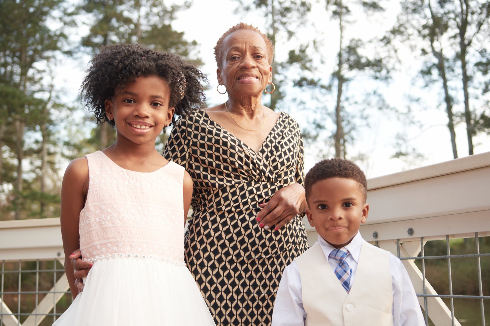 Three generations of the family standing together.